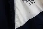 Z - Vintage 90s Reebok Embroidered Script Nylon Windbreaker sold by HG Vintage
