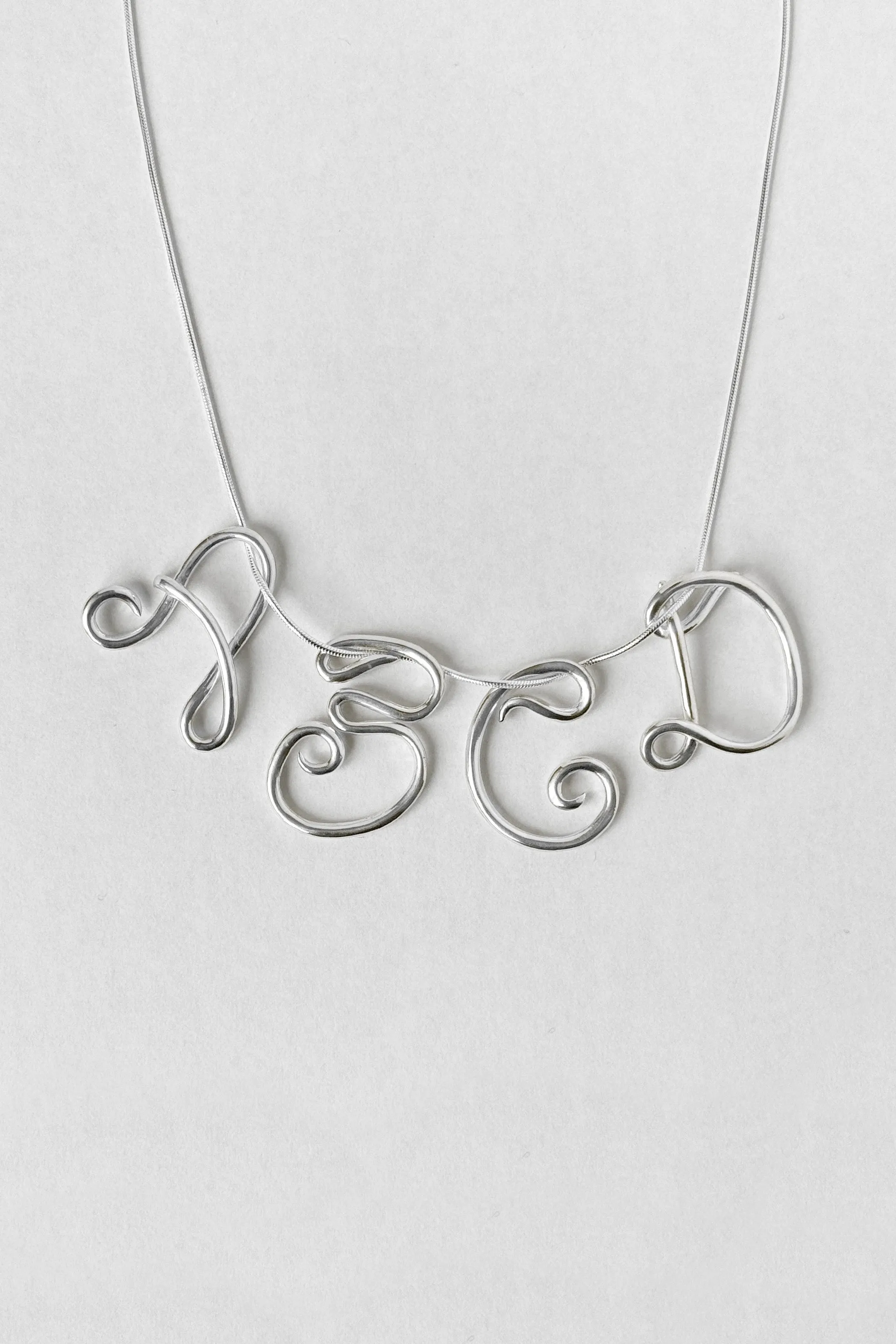 Initial Necklace sold by Kara Yoo