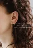 Anna Huggie Hoops sold by Kara Yoo