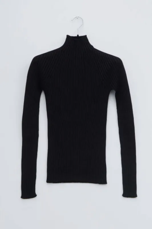 Kyra whole garment rib knit fitted turtlneck sold by Christian Wijnants