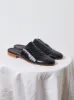 Leather Woven Slides in Black sold by Atelier Delphine
