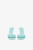 Mules in turquoise patent leather sold by Paris Texas
