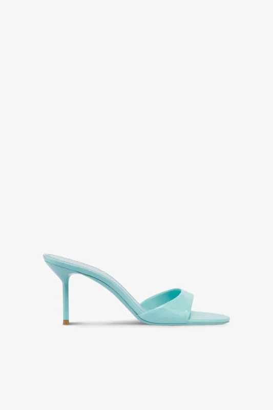 Mules in turquoise patent leather sold by Paris Texas