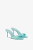 Mules in turquoise patent leather sold by Paris Texas
