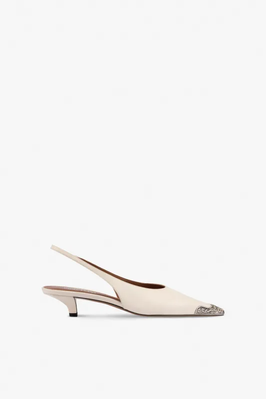 Slingbacks in milk white leather sold by Paris Texas
