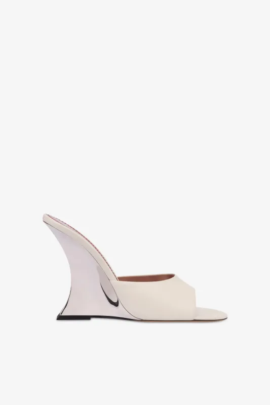 Mules in off-white and silver leather sold by Paris Texas