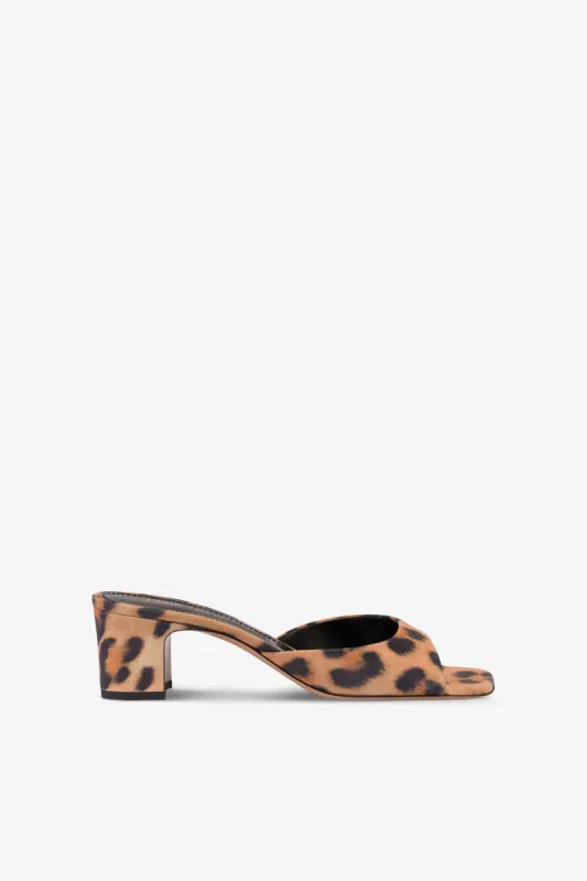 Mules in natural leopard-print suede leather sold by Paris Texas