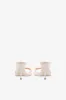 Mules in ivory patent leather sold by Paris Texas