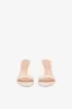 Mules in ivory patent leather sold by Paris Texas