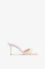 Mules in ivory patent leather sold by Paris Texas