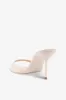 Mules in ivory patent leather sold by Paris Texas
