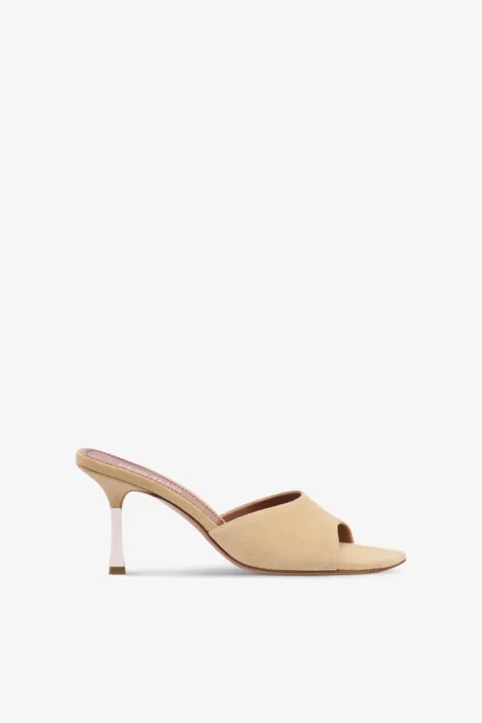 Mules in ecru suede leather sold by Paris Texas