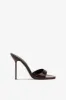 Mules in chocolate patent leather sold by Paris Texas