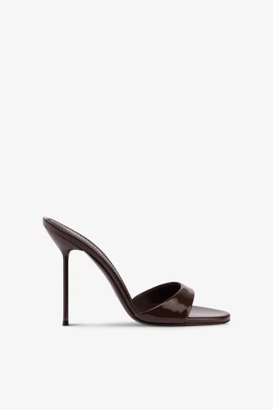 Mules in chocolate patent leather sold by Paris Texas
