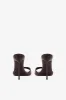 Mules in chocolate patent leather sold by Paris Texas