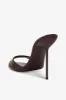 Mules in chocolate patent leather sold by Paris Texas