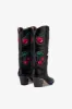 Boots in black leather sold by Paris Texas