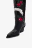 Boots in black leather sold by Paris Texas