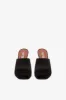 Mules in black satin sold by Paris Texas