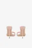 Mules in powder pink patent leather sold by Paris Texas
