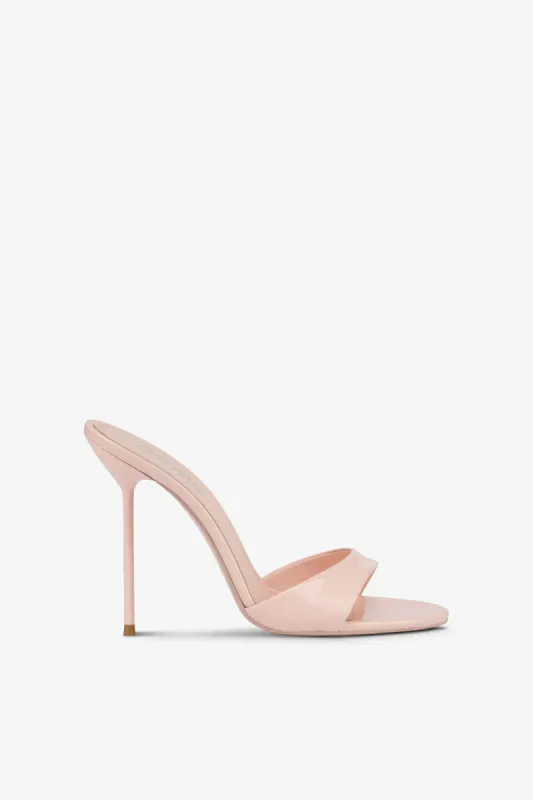 Mules in powder pink patent leather sold by Paris Texas