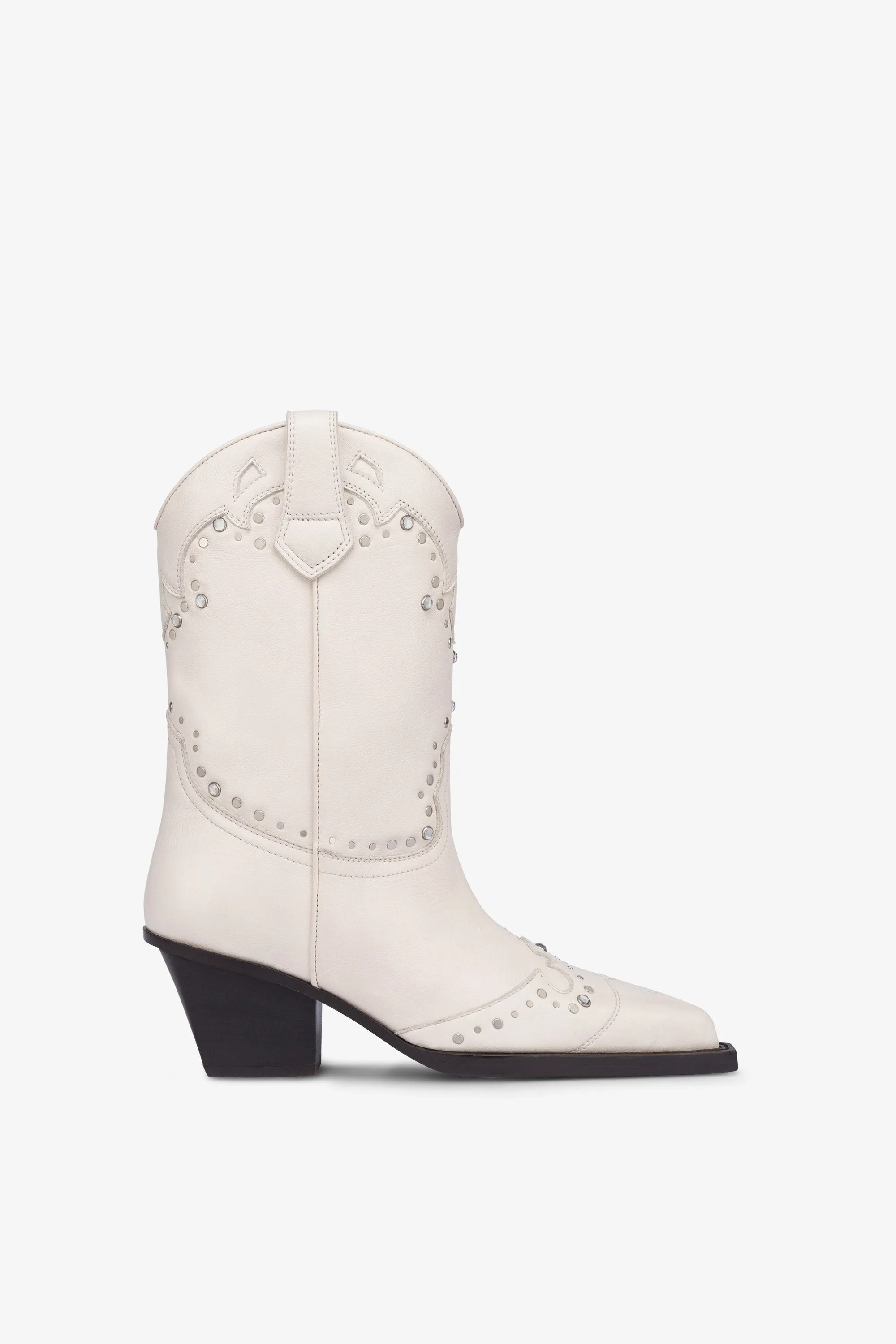 Boots in nickel-studded milk white leather sold by Paris Texas