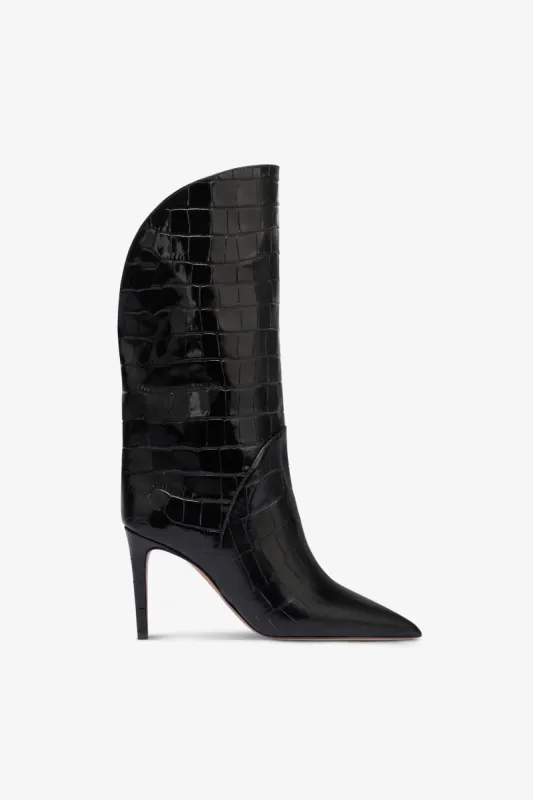 Boots in black croco-embossed leather sold by Paris Texas