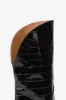 Boots in black croco-embossed leather sold by Paris Texas