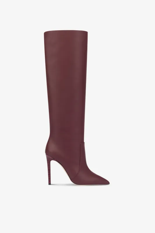 Pointed knee-high boots in smooth burgundy leather sold by Paris Texas
