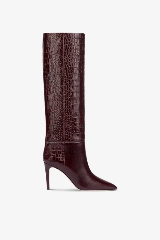 Pointed knee-high boots in rouge noir soft croco-embossed leather sold by Paris Texas