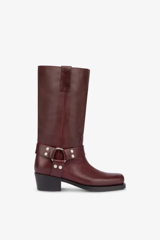 Square-toe boots in smooth plum leather sold by Paris Texas