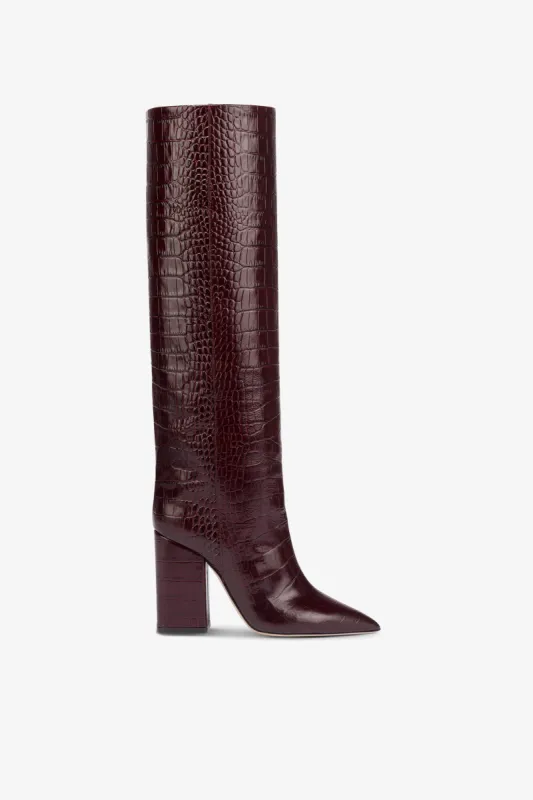 Knee-high boots in rouge noir soft croco-embossed leather sold by Paris Texas