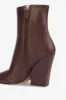 Pointed ankle boots in smooth mocha leather sold by Paris Texas