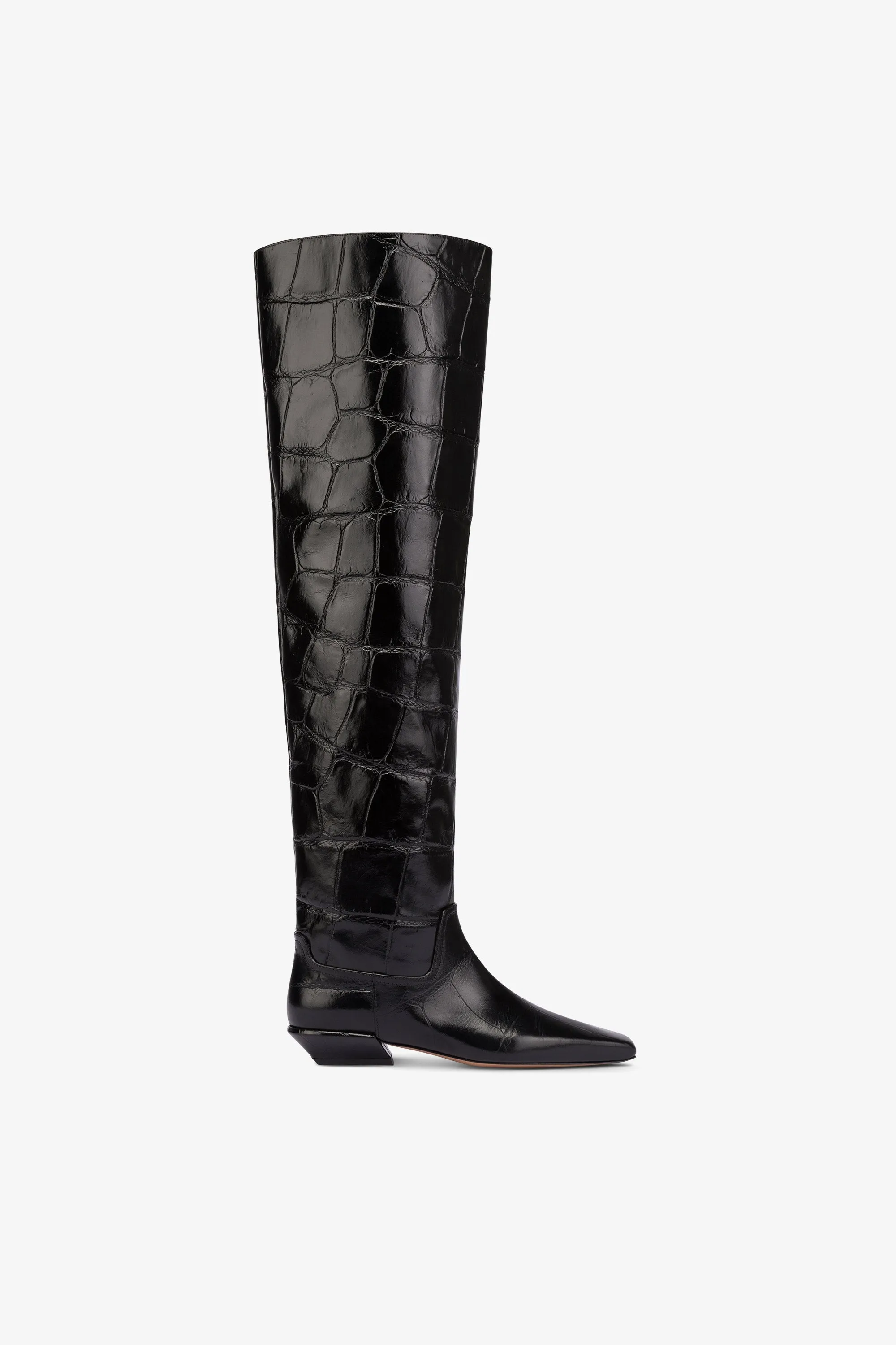 Over-the-knee boots in black croco-embossed leather sold by Paris Texas