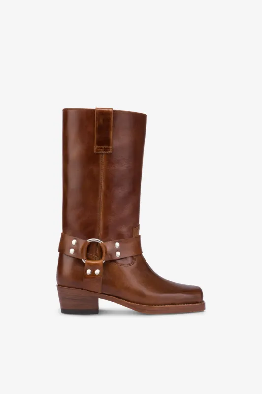 Square-toe boots in shiny vintage leather sold by Paris Texas