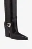 Tall, knee-high boots in shiny black vintage leather sold by Paris Texas