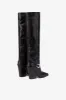 Tall, knee-high boots in shiny black vintage leather sold by Paris Texas