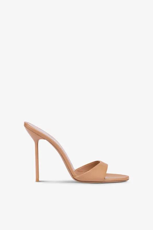Almond-toe mules in patent caramel leather sold by Paris Texas