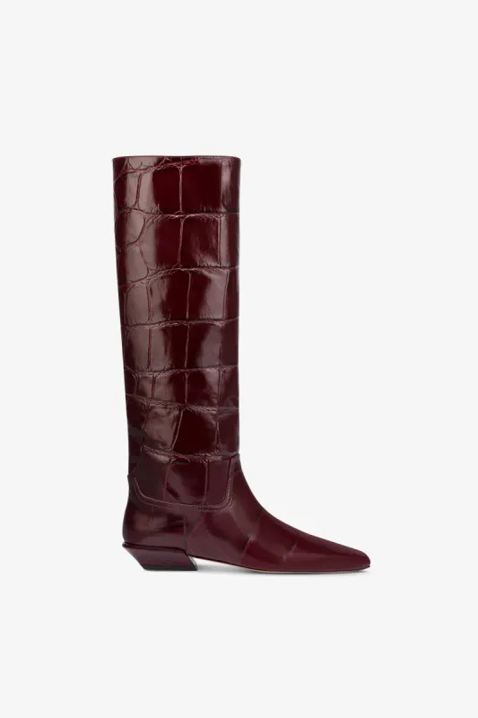 Knee-high boots in hevea maxi croco-embossed leather sold by Paris Texas