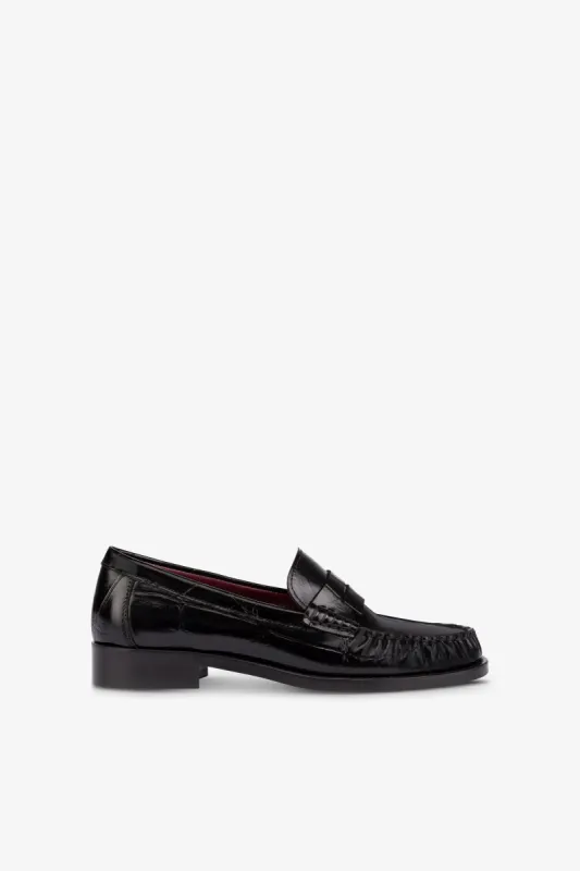 Loafer shoes in black maxi croco-embossed leather sold by Paris Texas