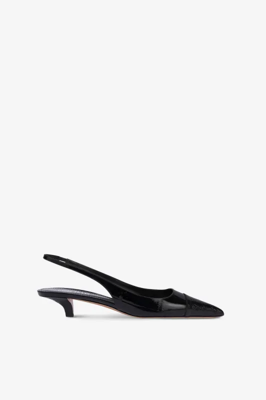 Slingbacks in black croco-embossed leather sold by Paris Texas