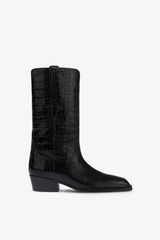 Boots in black croco-embossed leather sold by Paris Texas