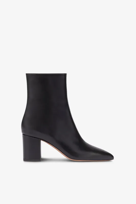 Pointed ankle boots in smooth black leather sold by Paris Texas