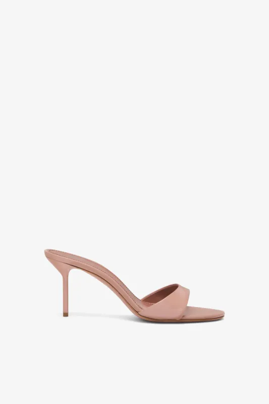 Dark blush patent leather mule sold by Paris Texas