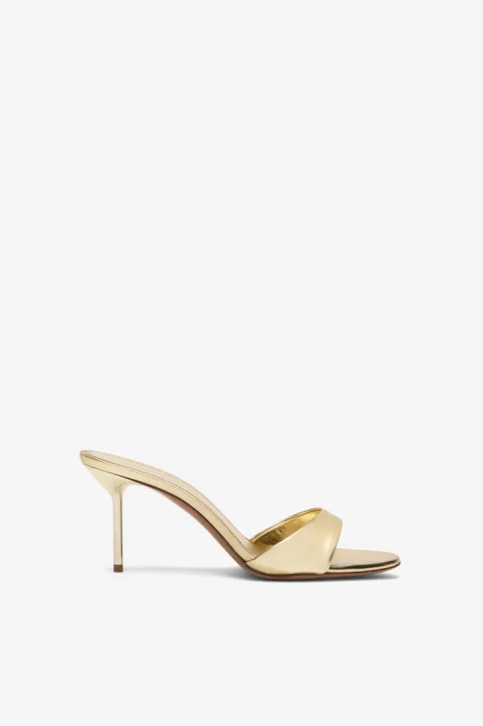 Gold mirrored leather mule sold by Paris Texas
