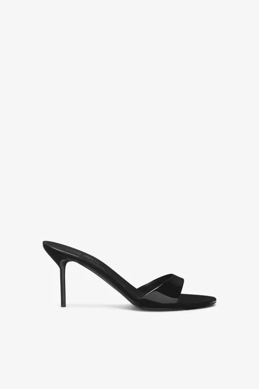 Black patent leather mule sold by Paris Texas