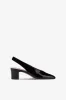 Slingbacks in black patent leather sold by Paris Texas