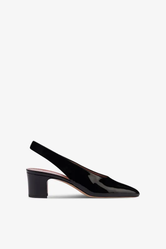 Slingbacks in black patent leather sold by Paris Texas