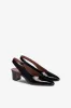 Slingbacks in black patent leather sold by Paris Texas