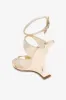 Sandals in platinum mirror-effect leather sold by Paris Texas